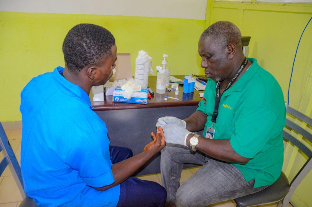 A health worker conducting an HIV screening activity