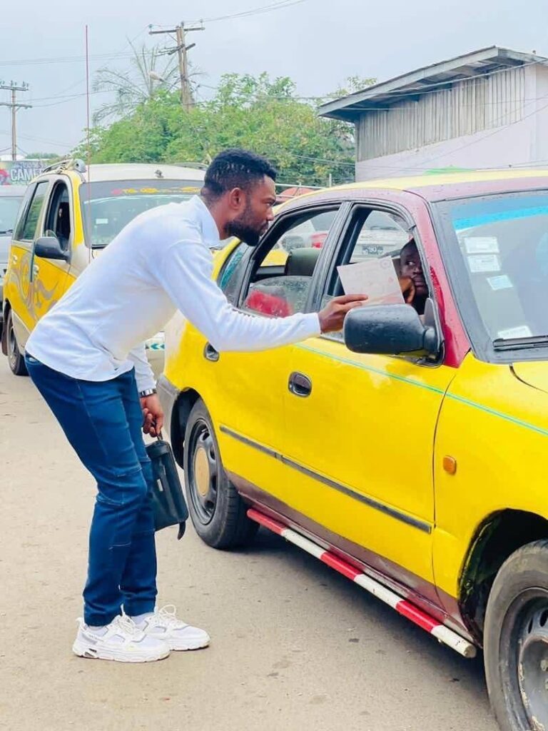 A volunteer sharing health information with a driver