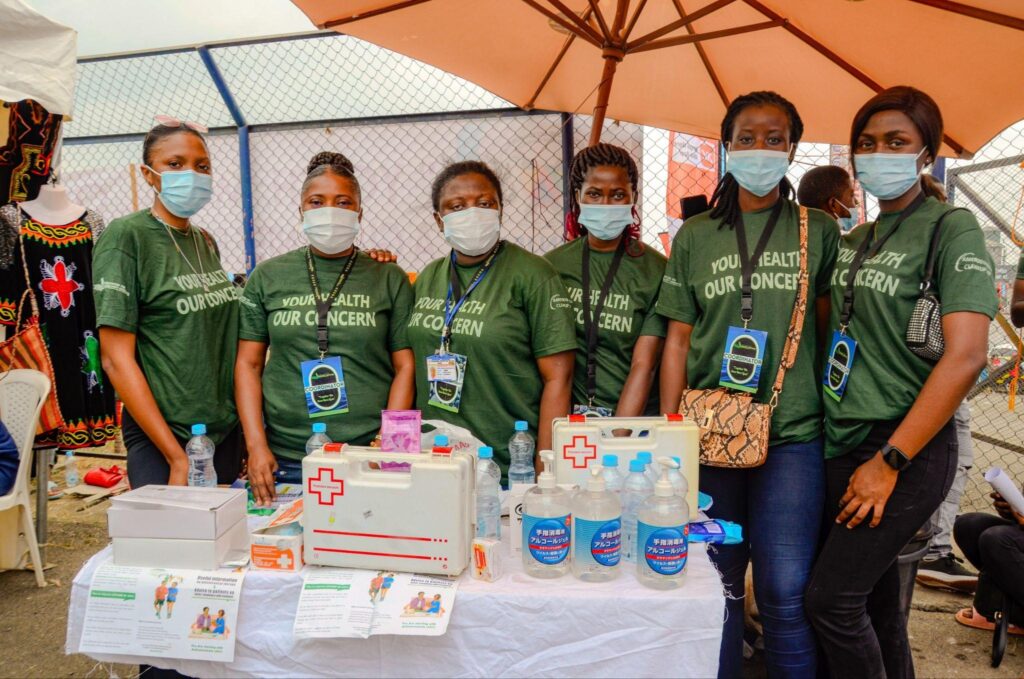 ASCOA health volunteers at a public health outreach stand