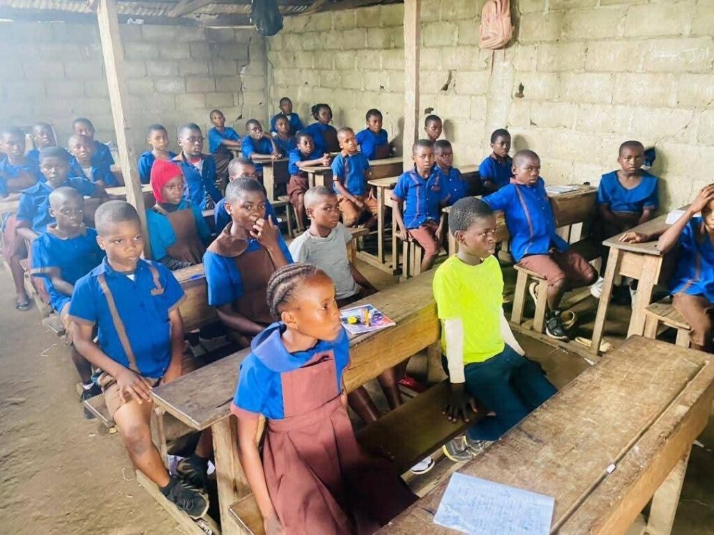 Pupils participating in a classroom peace activity