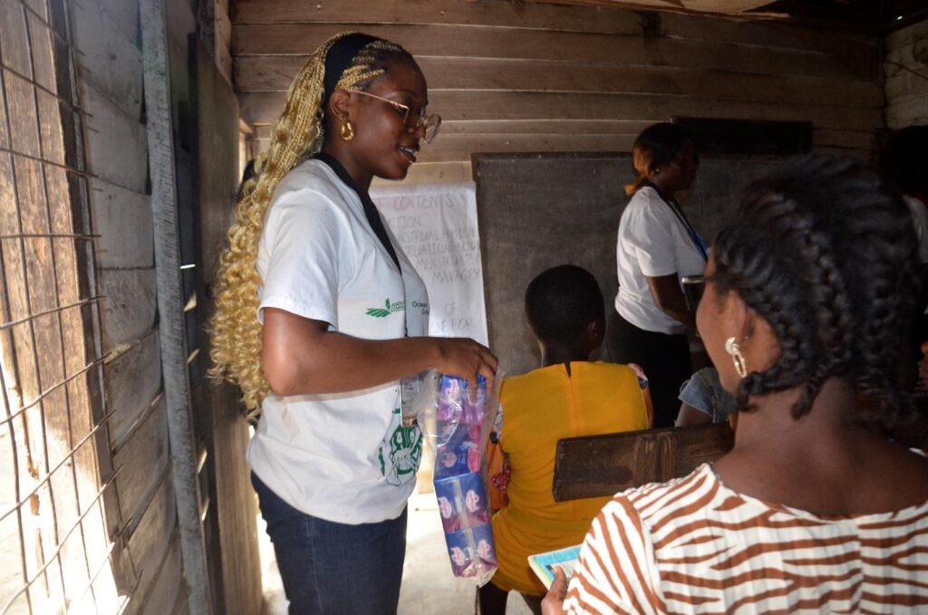 A facilitator speaking during an ASCOA menstrual health session